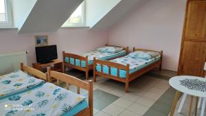 Katil atau katil-katil dalam bilik di Apartamenty pokoje Błękit Mielno