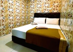 Postel nebo postele na pokoji v ubytování Damansara Damai Hotel- DD