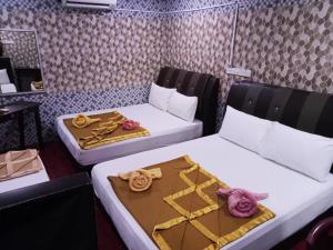 Postel nebo postele na pokoji v ubytování Damansara Damai Hotel- DD