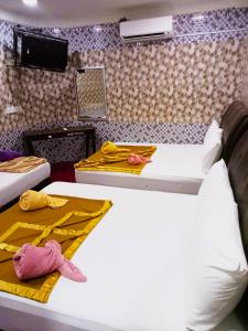Postel nebo postele na pokoji v ubytování Damansara Damai Hotel- DD