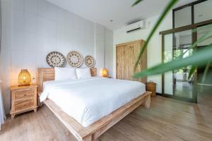 Postel nebo postele na pokoji v ubytování Gajahmina Guesthouse