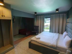 Postel nebo postele na pokoji v ubytování Momento Resort