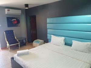 Postel nebo postele na pokoji v ubytování Momento Resort
