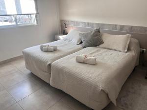 Ένα ή περισσότερα κρεβάτια σε δωμάτιο στο Apart Luro V