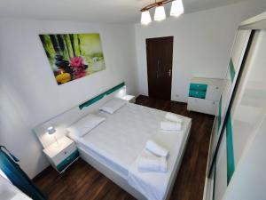 Ένα ή περισσότερα κρεβάτια σε δωμάτιο στο Zen Apartament