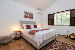 Giường trong phòng chung tại 3BR Paradise, Casa Azul by HM