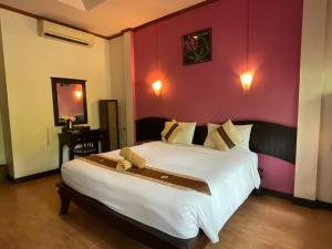 Rúm í herbergi á Seashell Resort Koh Tao-SHA Plus