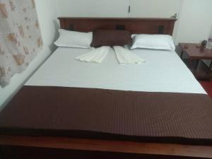 Postel nebo postele na pokoji v ubytování Tamarind Tree View Villa