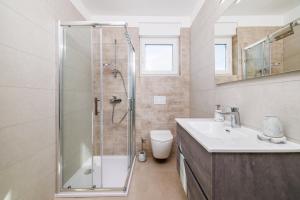 a bathroom with a shower and a sink at Schmidt veliki in Dramalj +32 photos