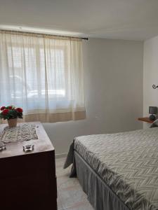 a bedroom with a bed and a window at Casa wendy in Bolsena
