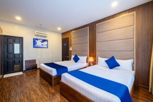 Postel nebo postele na pokoji v ubytování Sandals Hotel