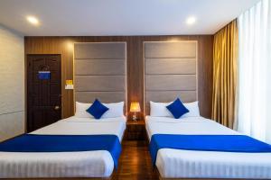 Postel nebo postele na pokoji v ubytování Sandals Hotel