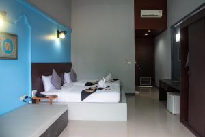 Postel nebo postele na pokoji v ubytování Arawan Beach Resort Krabi