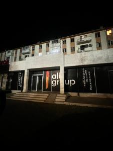 a building with a sign that reads gift up at ИП.МЕДИНА in Taraz