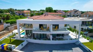 an aerial view of a large white house at Villa Sarah in Vantačići +42 photos