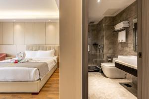 Postel nebo postele na pokoji v ubytování Bole Jing Pin Hotel
