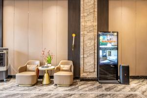 TV a/nebo společenská místnost v ubytování Bole Jing Pin Hotel
