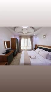 Postel nebo postele na pokoji v ubytování ريلاكس إن للشقق الفندقية Relax Inn Hotel Appartment