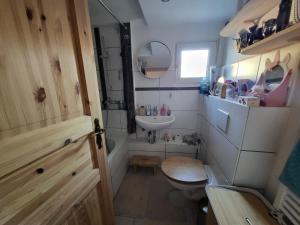 a small bathroom with a sink and a toilet at Apartments Sonne am Sund in Stralsund +109 photos