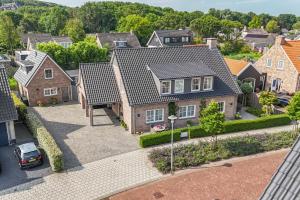 an aerial view of a residential neighbourhood with houses at Villa Zuiderduin cottage in Zoutelande