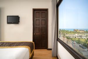 Postel nebo postele na pokoji v ubytování Zenta Sea View Hotel