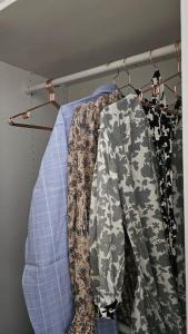 a group of clothes are hanging on a rack at MOMA apartments - enjoy moments in Liepāja +42 photos