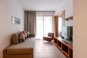TV a/nebo společenská místnost v ubytování NM Suites by Escampa Hotels