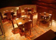 an overhead view of a restaurant with tables and chairs at Hotel Apaar in Diu