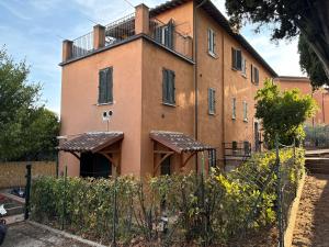 a building with a fence in front of it at Cozy Apartment with Garden in Perugia