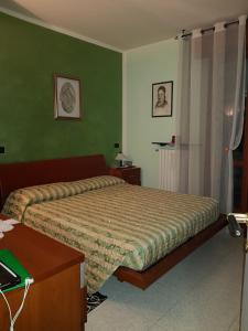A bed or beds in a room at B&B da Silvana a Talamello