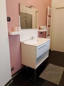 a bathroom with a sink and a mirror at Appartamento Casa Libe in Ornavasso +37 photos