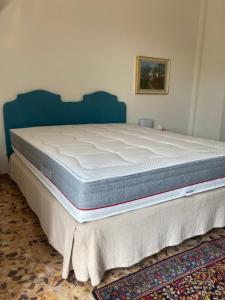 A bed or beds in a room at Attico San Francesco