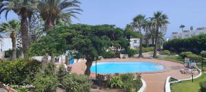 an image of a swimming pool in a resort at Sunrise Apartamentos in San Bartolomé