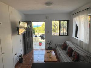 a living room with a couch and a table at Galini 1 in Kalamata