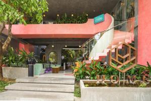 a building with a staircase with a sign on it at HOME Hotel in Ho Chi Minh City