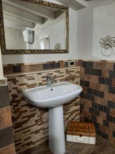 a bathroom with a sink and a mirror at La Casa Di Piero e Mary in Brucoli +67 photos