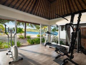 an open gym with fitness equipment in a villa at Sudamala Resort, Seraya, Flores in Labuan Bajo