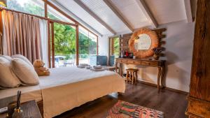 a bedroom with a bed and a table and window at Lulu Inn Cesme in Çeşme +45 photos
