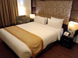 Postel nebo postele na pokoji v ubytování Hotel Oxina Lygon