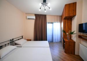Postel nebo postele na pokoji v ubytování Labu Hotel