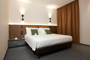 Postel nebo postele na pokoji v ubytování Best Western Hotel Biri + 37 fotografií