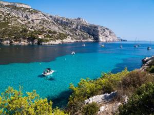 a boat in a large body of water at Maison Marseille Vauban in Marseille +13 photos
