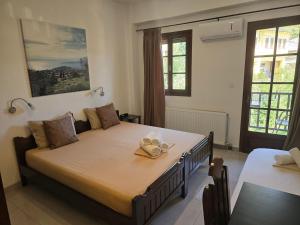 Postel nebo postele na pokoji v ubytování Karidia Apartments