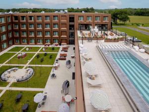 an overhead view of a hotel with a swimming pool at TRIBE Milano Malpensa in Vizzola Ticino