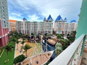 arial view of a resort with a river and buildings at Grande Cariibbean Pattaya by Thita in Pattaya South