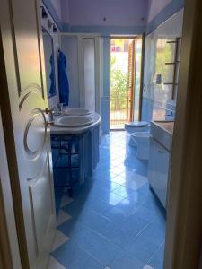 a bathroom with a sink and a toilet at Il Pino Argentato in Gragnano +19 photos