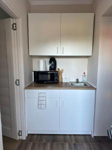 Kuchyňa alebo kuchynka v ubytovaní Réz Apartmanok Gyula