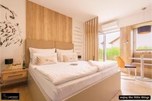 Postel nebo postele na pokoji v ubytování Vitalpension Bad Blumau - ADULTS ONLY + 21 fotografií