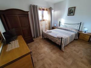 Postel nebo postele na pokoji v ubytování Agriturismo Campo alla Cantina appartamento Ginestra
