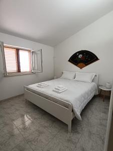 Postel nebo postele na pokoji v ubytování Villa Marina
